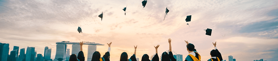Graduates tossing caps